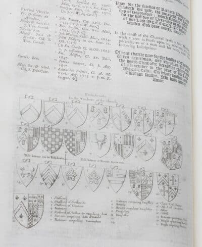 Black and white illustrations of numerous heraldic shields.