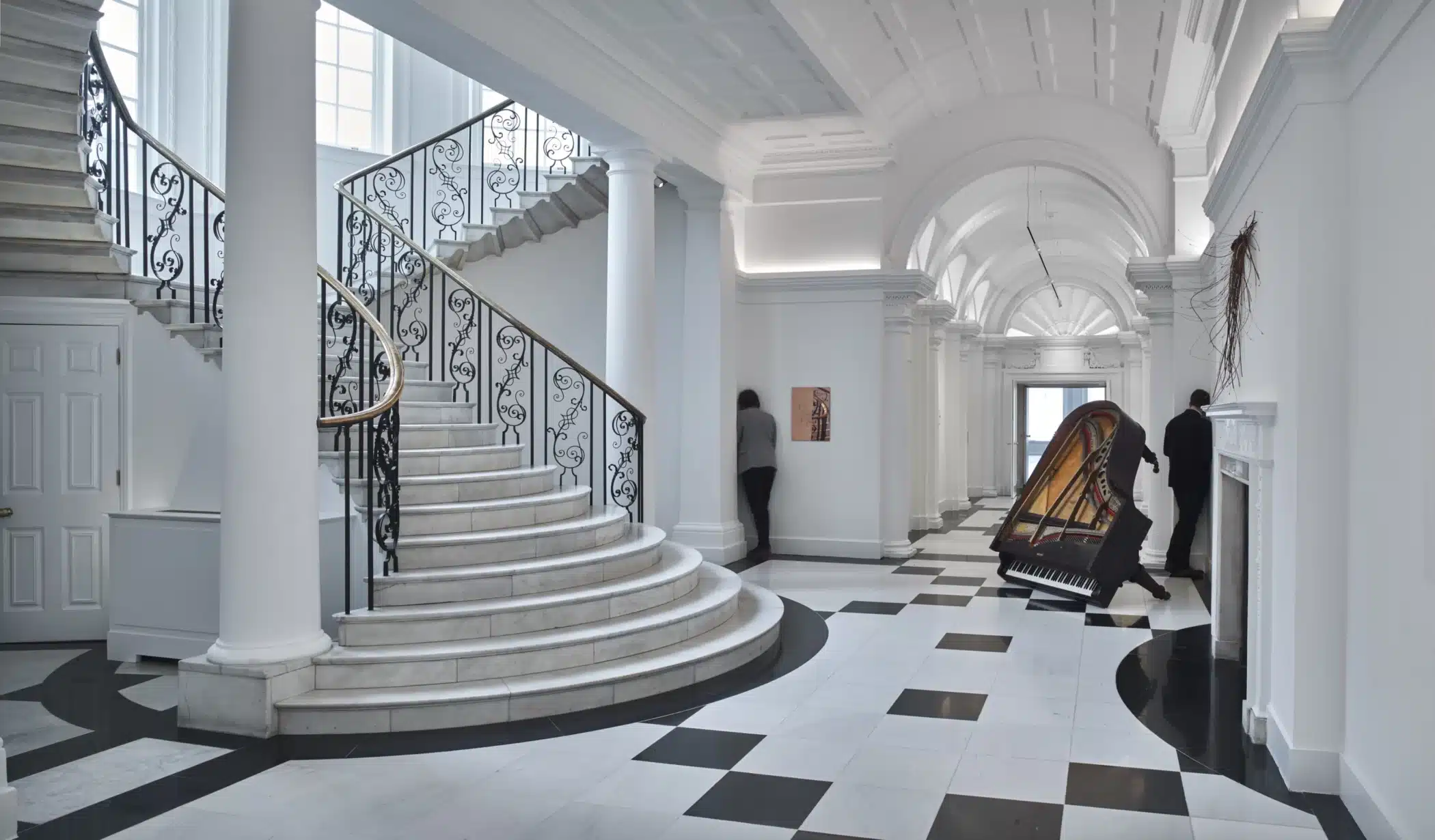 Installation view of Oliver Beer exhibition with upturned grand piano