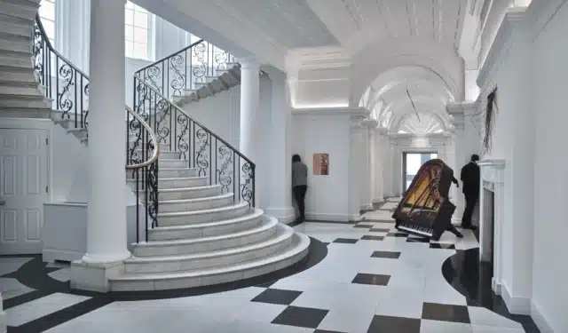 Installation view of Oliver Beer exhibition with upturned grand piano