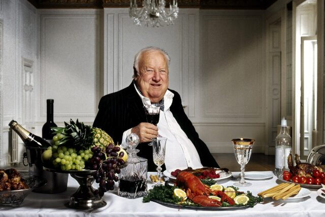 Godfrey Smith sat at a banquet table