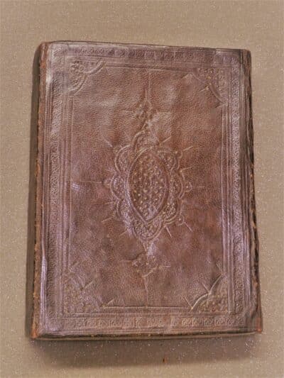 Back of wrap around binding, with gold and blind tooling.