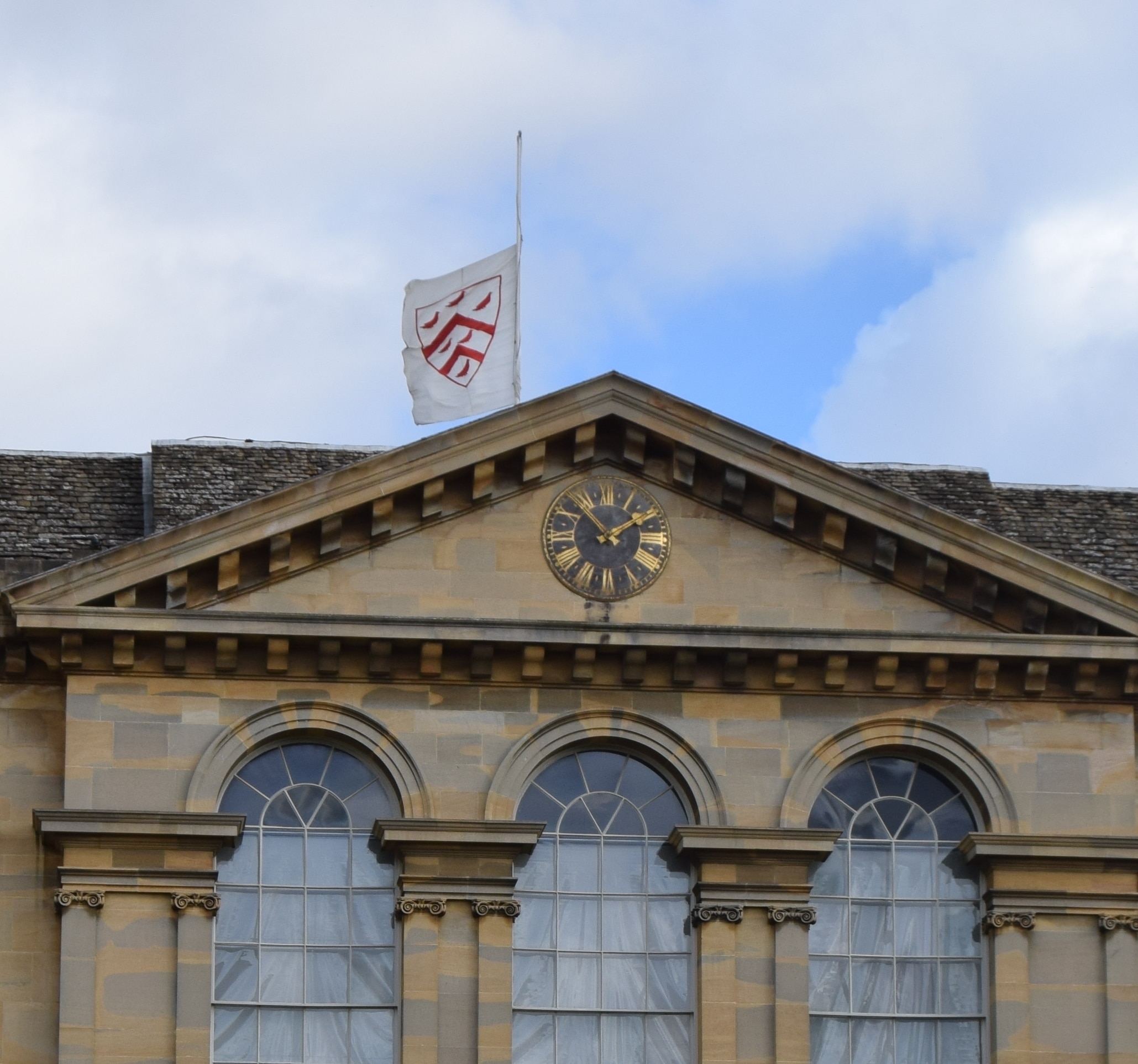 Worcester College flag flying at half mast