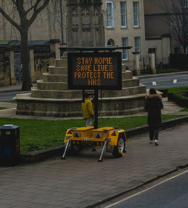 Temporary traffic sign reading stay home, save lives, protect the NHS