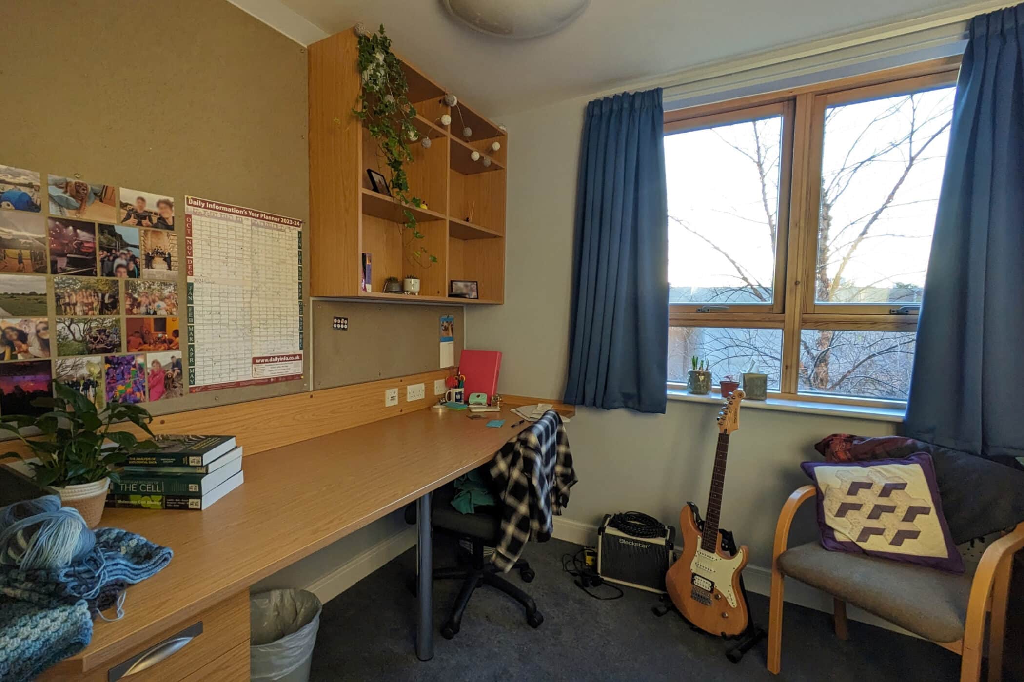 Desk and armchair in Earl Building bedroom