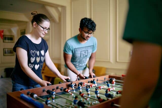 Students playing table football