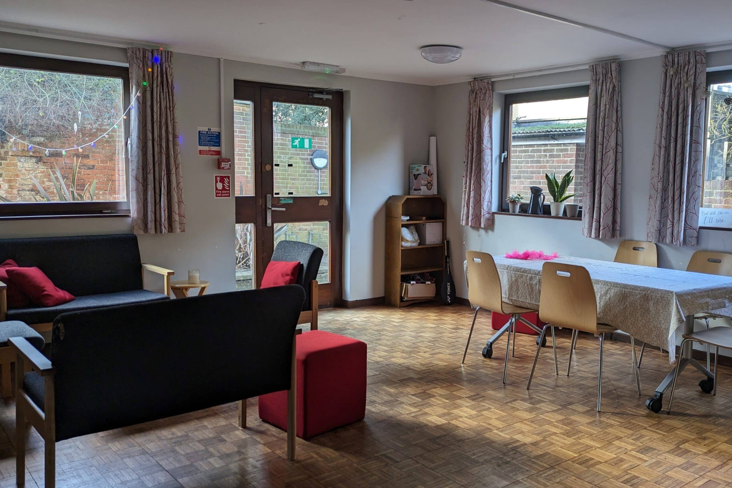 Common room with table, chairs and sofas in Mitchell Building