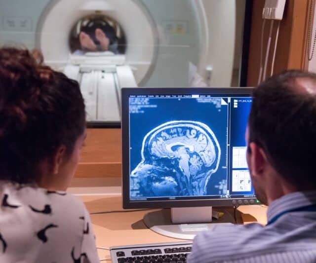 Researchers looking at MRI scan