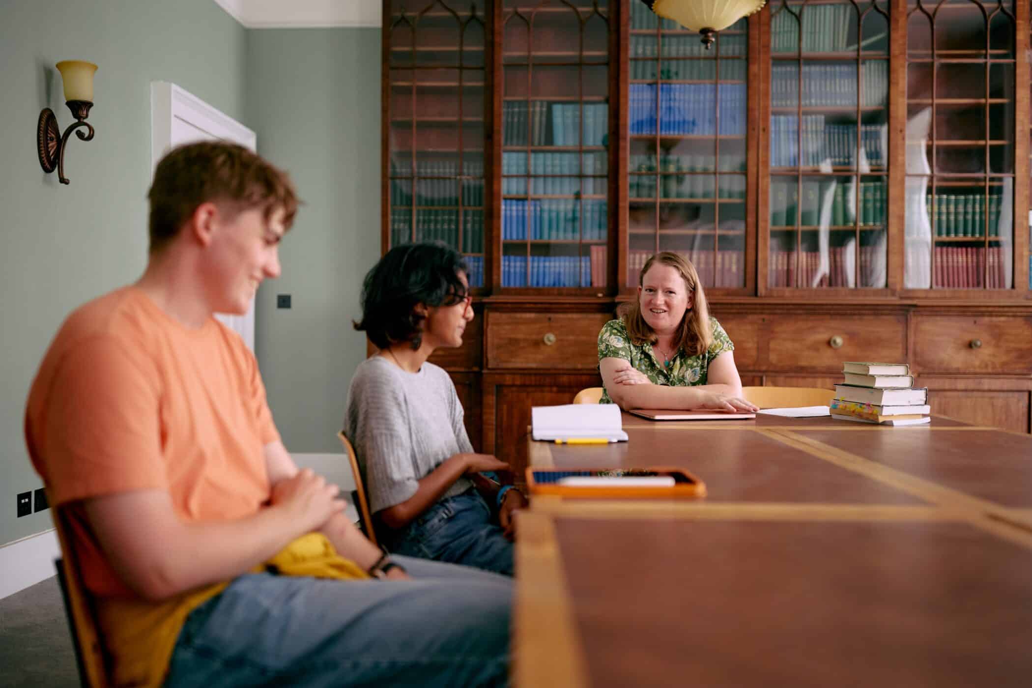 Students and tutor sat around table