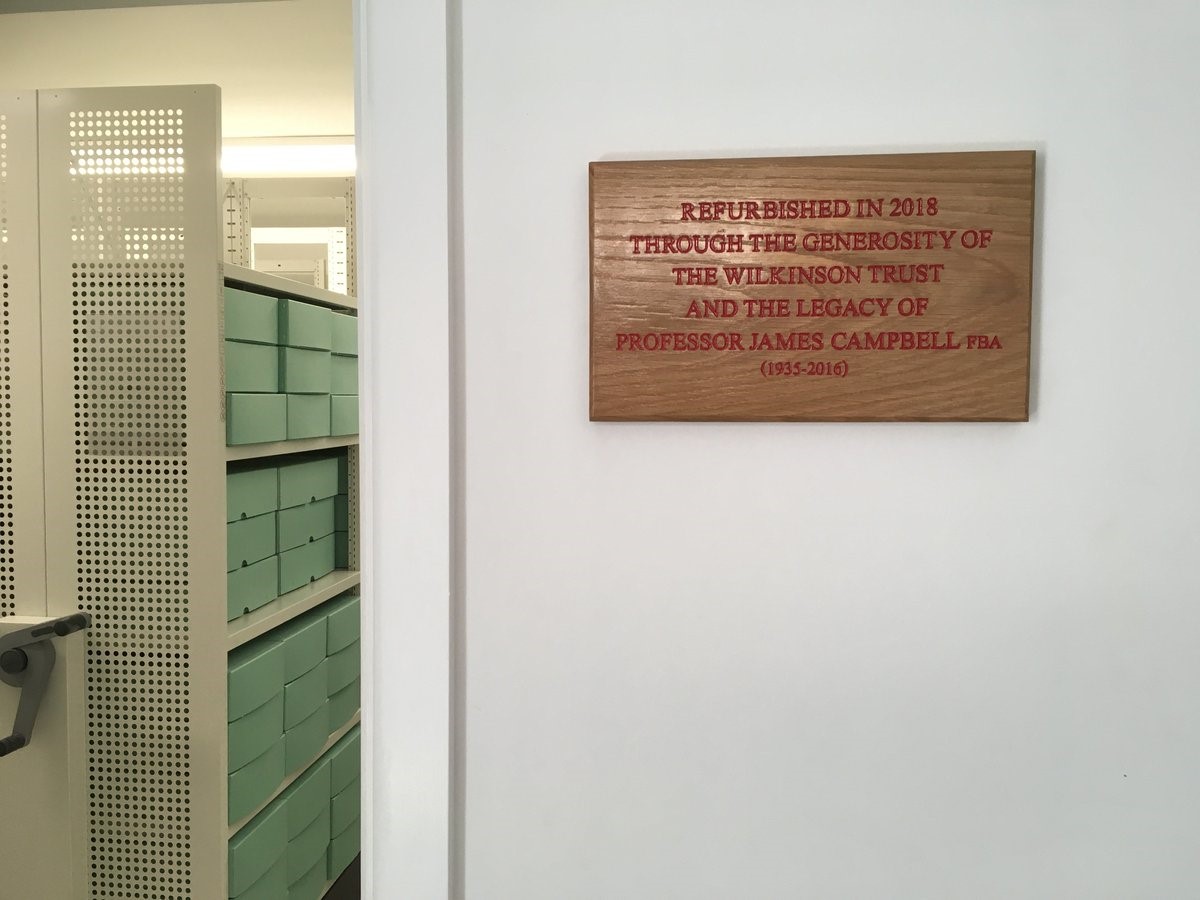 Photograph of dedication plaque in archives. It reads 'refurbished in 2018 through the generosity of the Wilkinson Trust and the legacy of Professor James Campbell FBA (1935-2016)'.