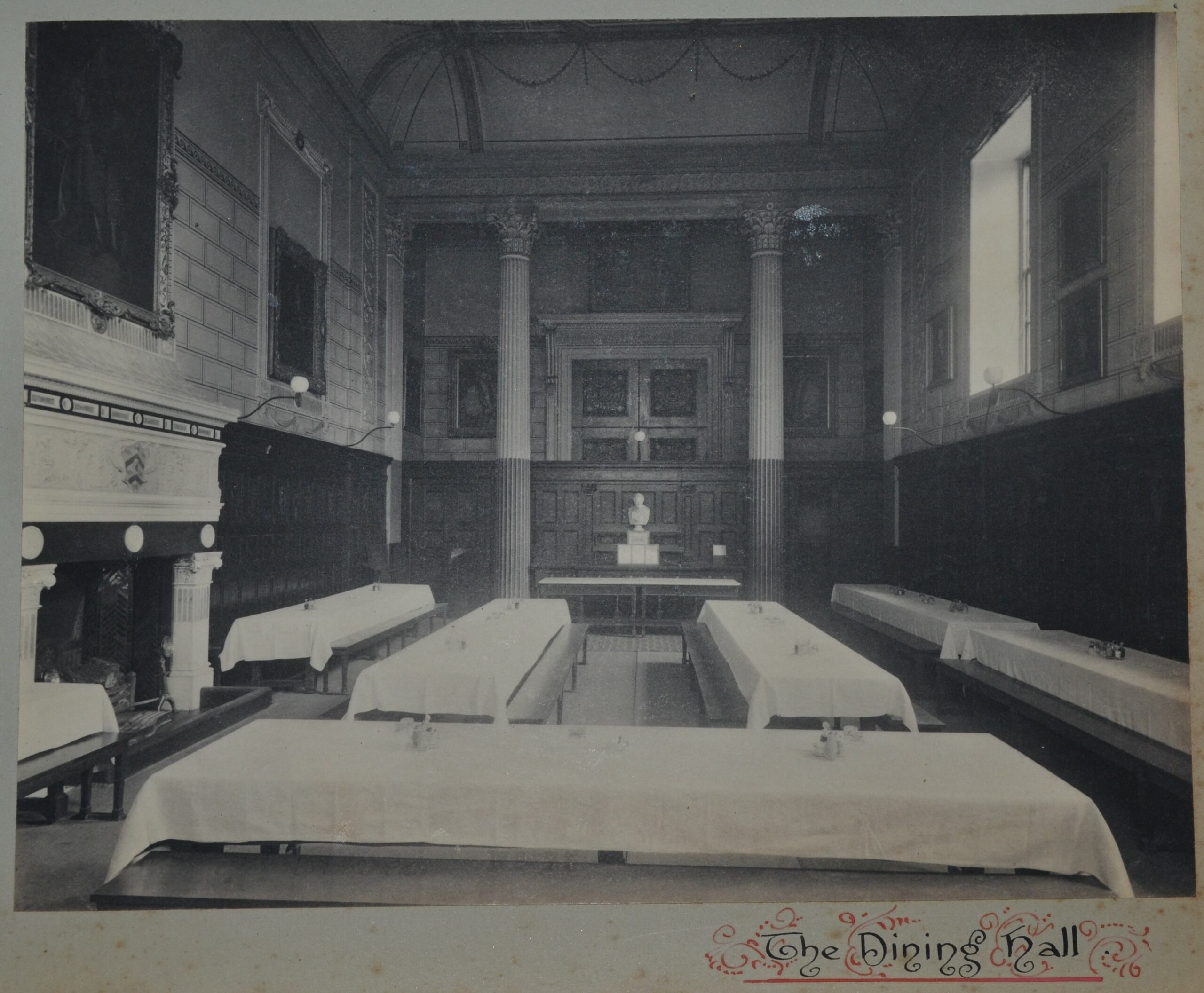 Black and white photograph of the hall from 1899, looking toward the door.