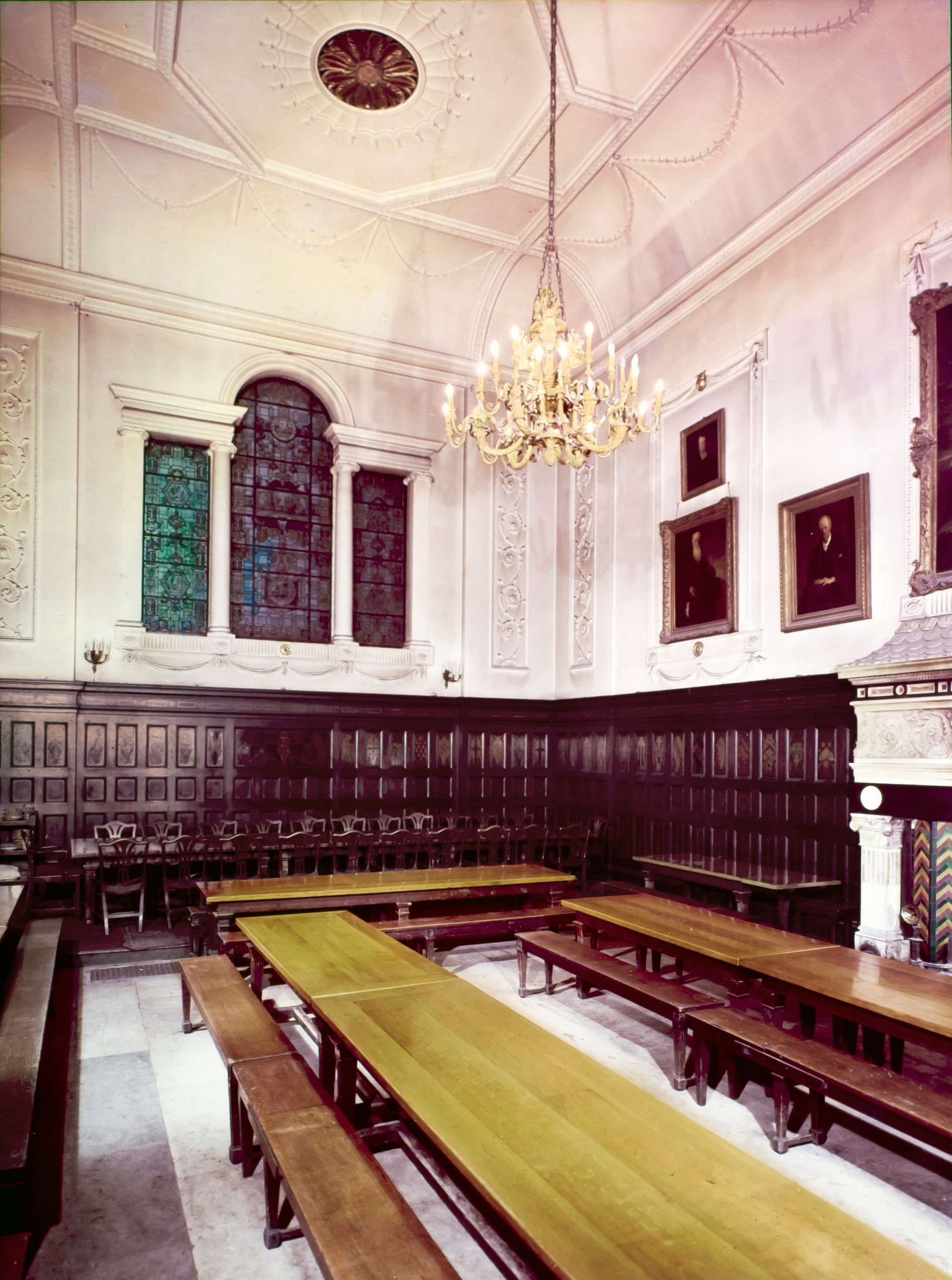 Colour photograph of the hall in 1966, the wood panelling is still in place but the walls and ceiling have been painted white.