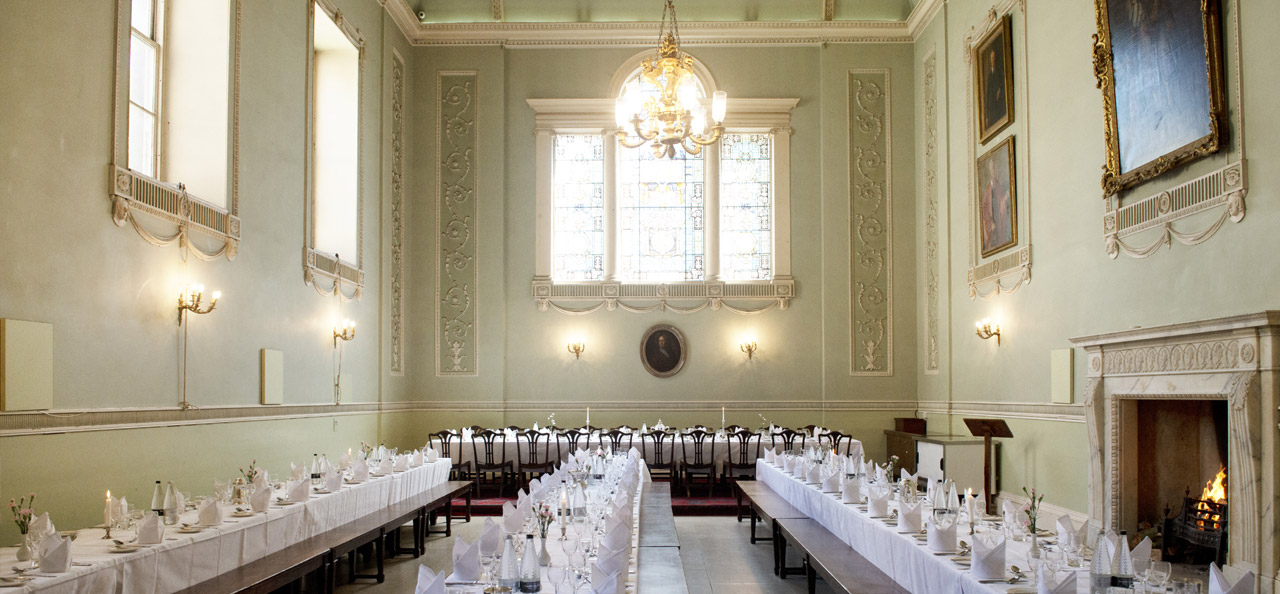 Colour photograph of the hall in 2015, with the tables set for a formal dinner.