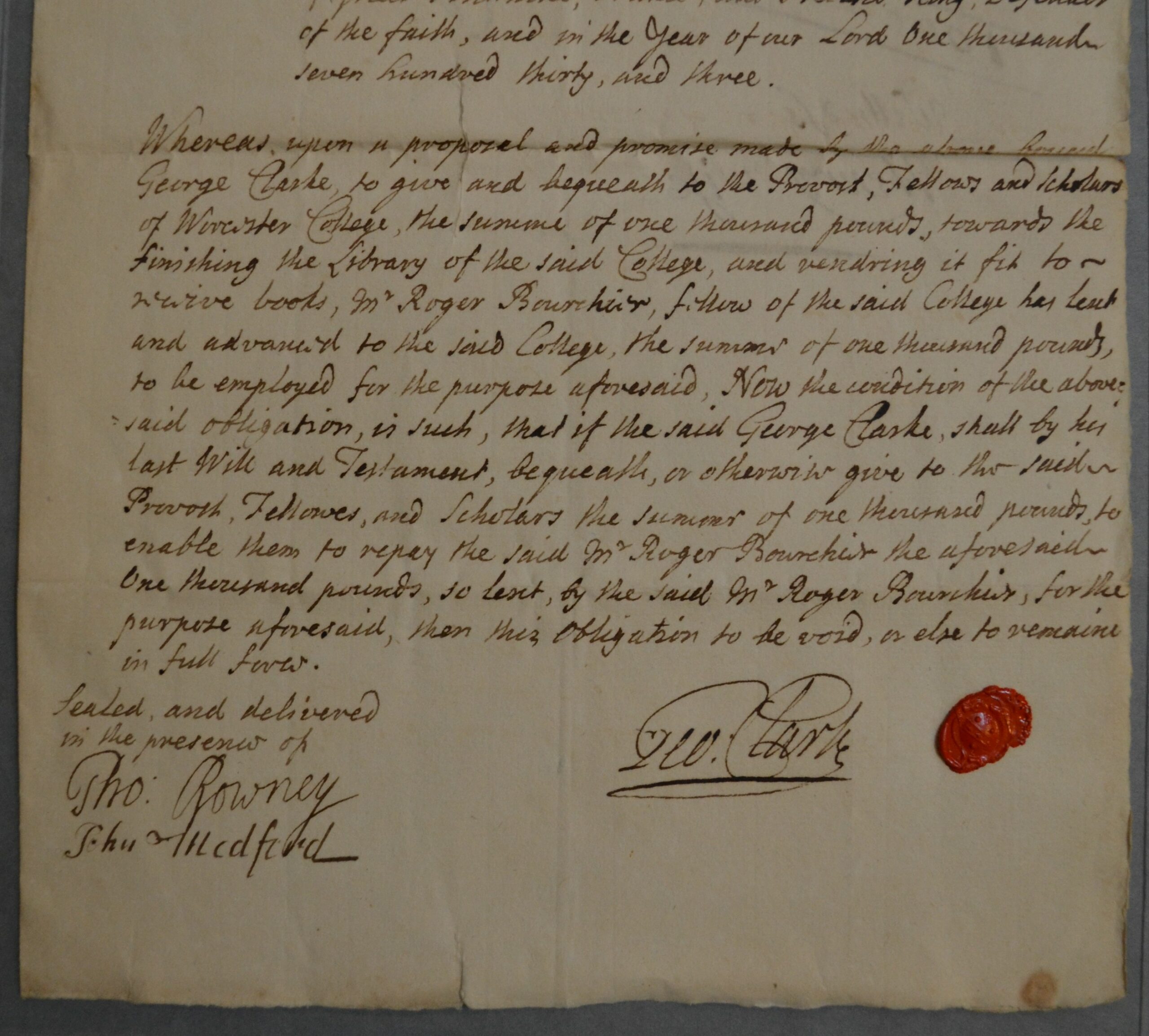 Photograph of manuscript bond from George Clarke bearing his seal in red wax near the bottom.
