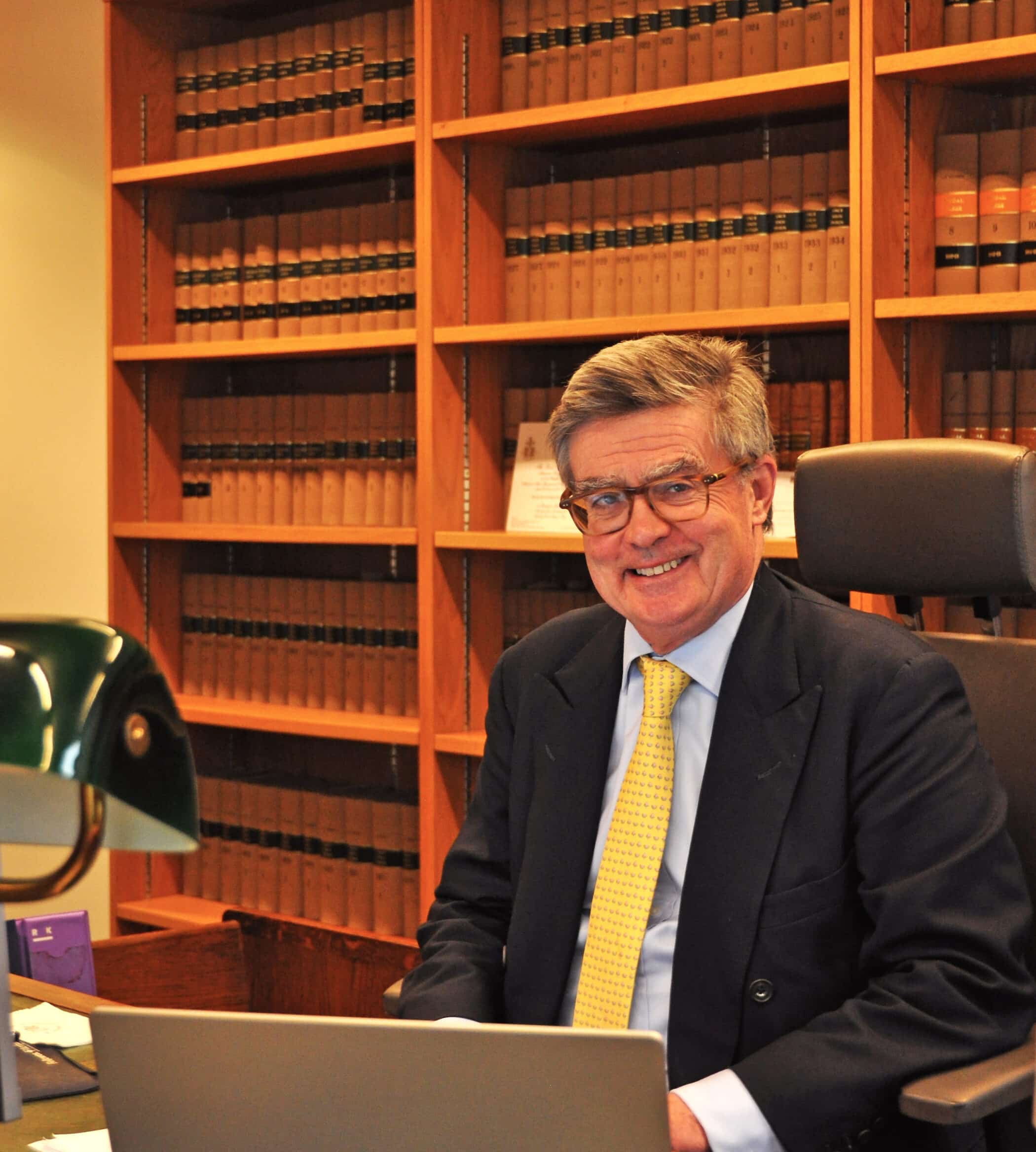 Sir Julian Flaux at his desk
