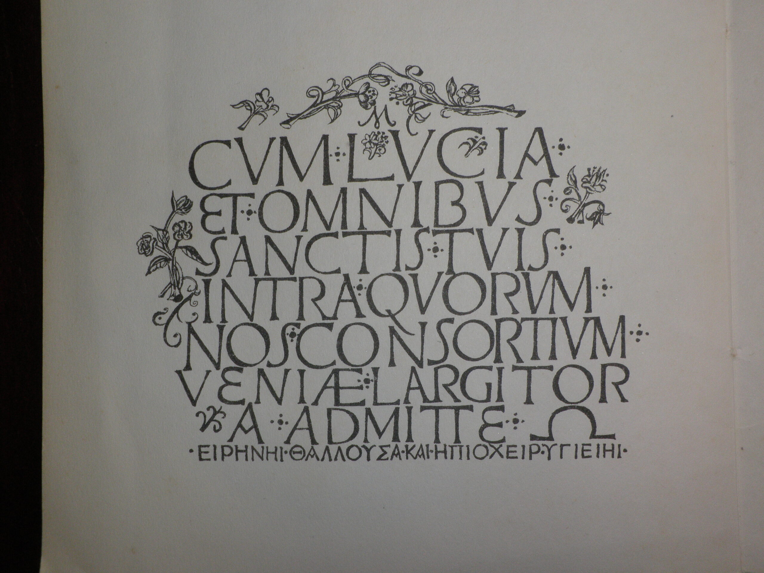 Latin and Greek inscription at foot of the poem. The text is decorated with stylized printed flowers.