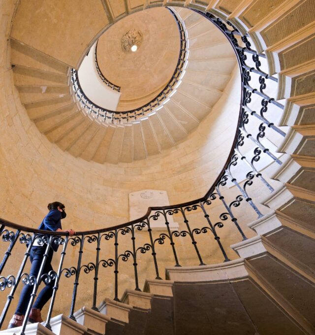 Looking up at the spiral staircase to the library