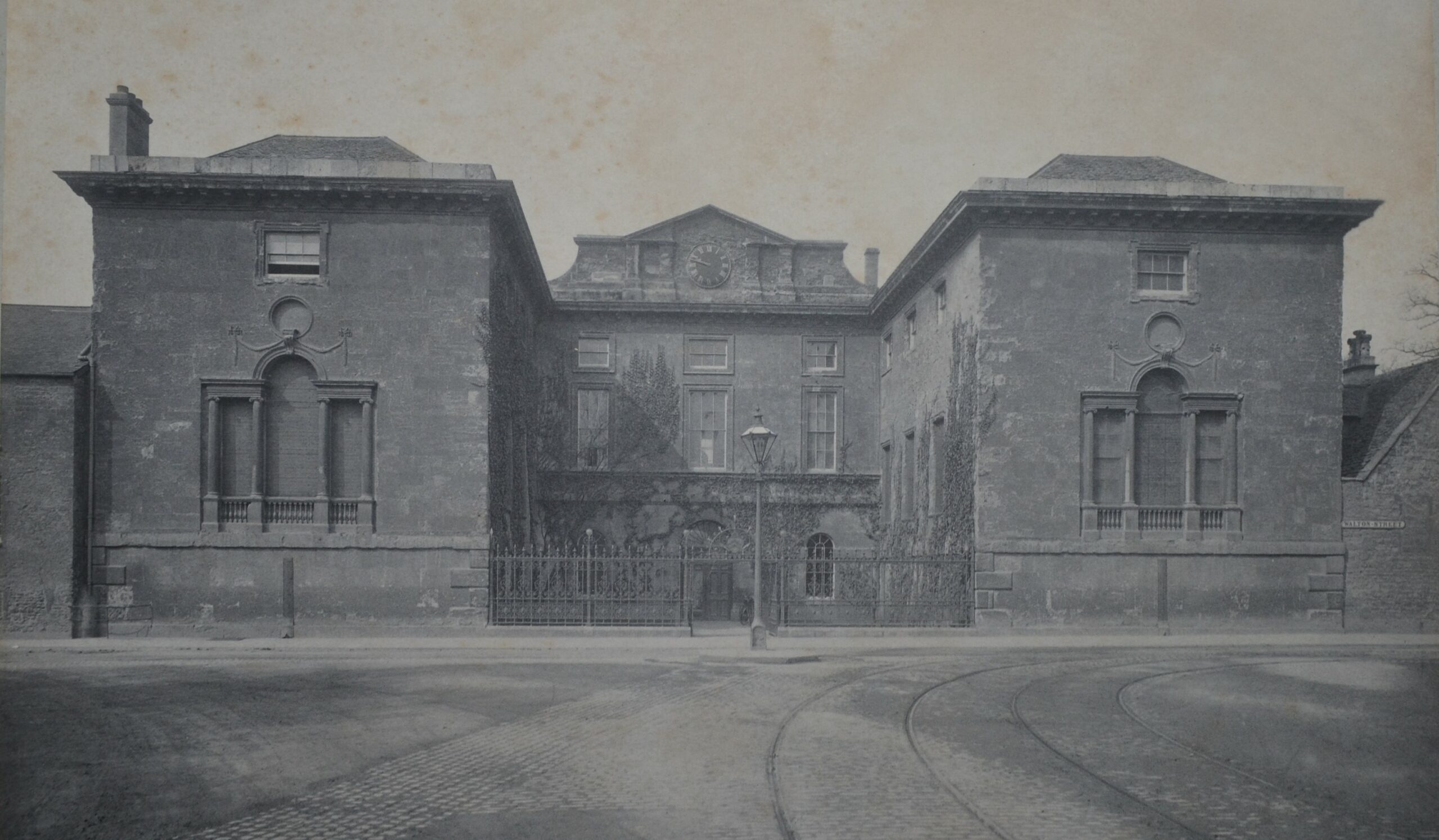 Black and white photograph of the front of College circa 1908.