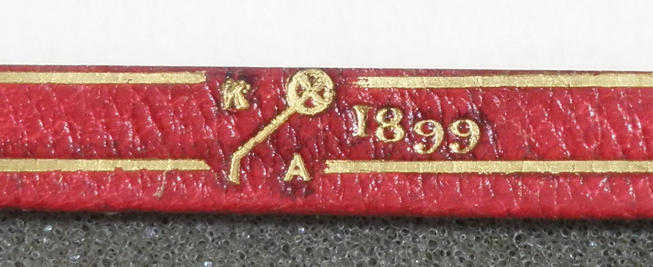 Detail of Katherine Adams' binding signature, dated 1899.