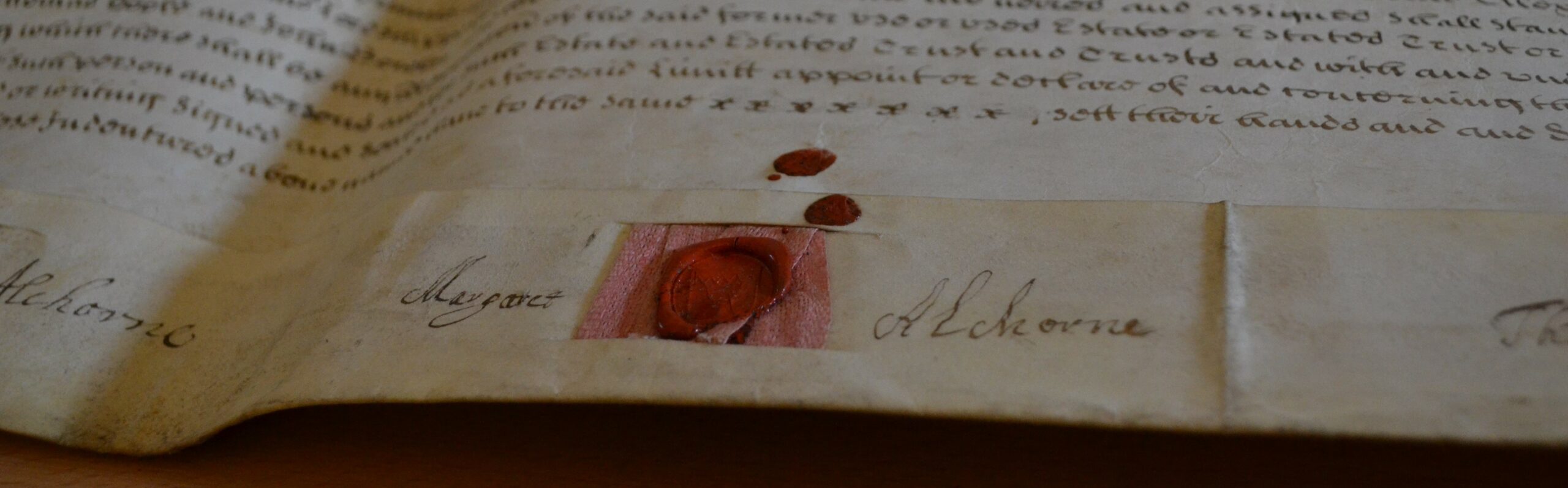Photograph of Margaret Alchorne's signature with a red wax seal.