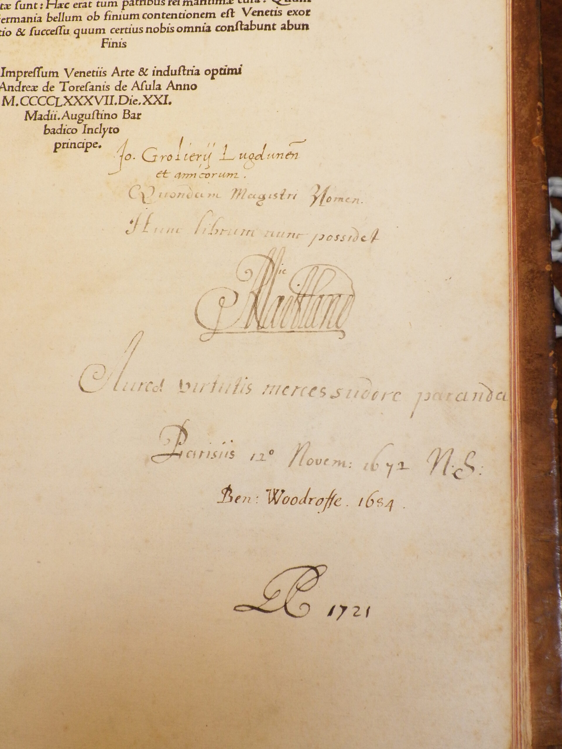 Photograph of handwritten inscriptions beneath the colophon, showing a series of owners.