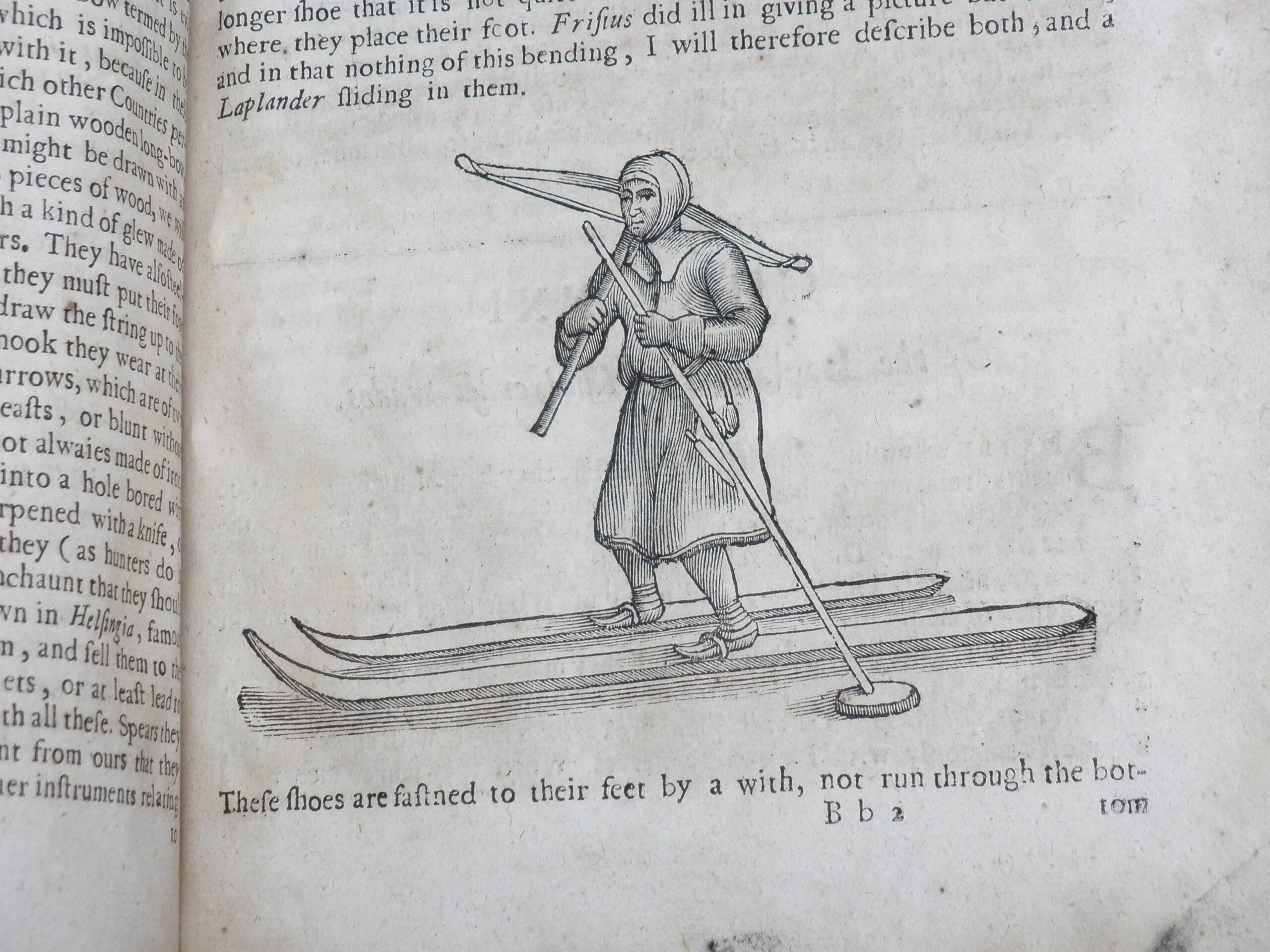 Woodcut illustration of a figure on skis, carrying a crossbow.