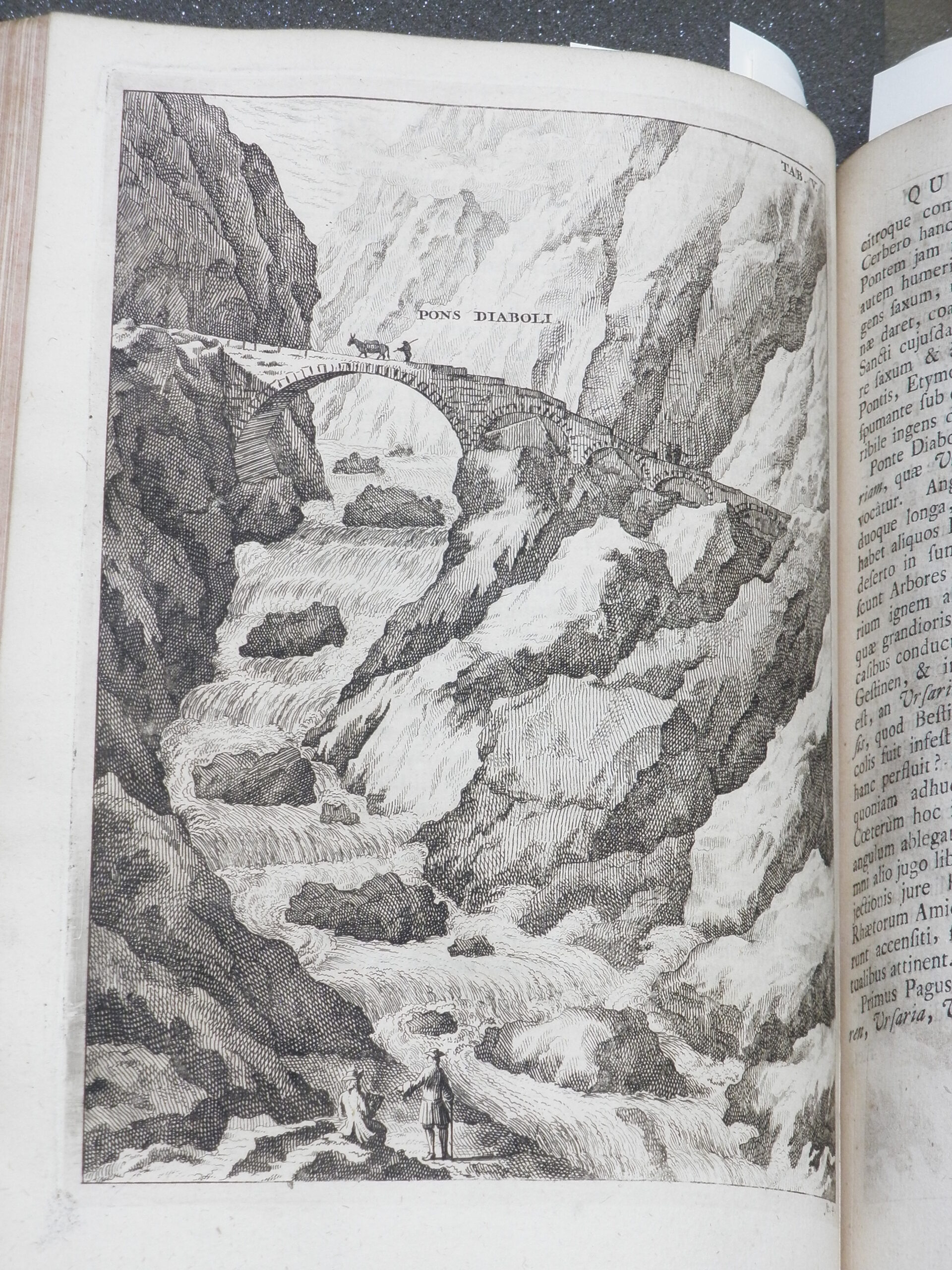 Engraved image of a bridge over a river flowing through the mountains. Labelled 'pons diaboli'.