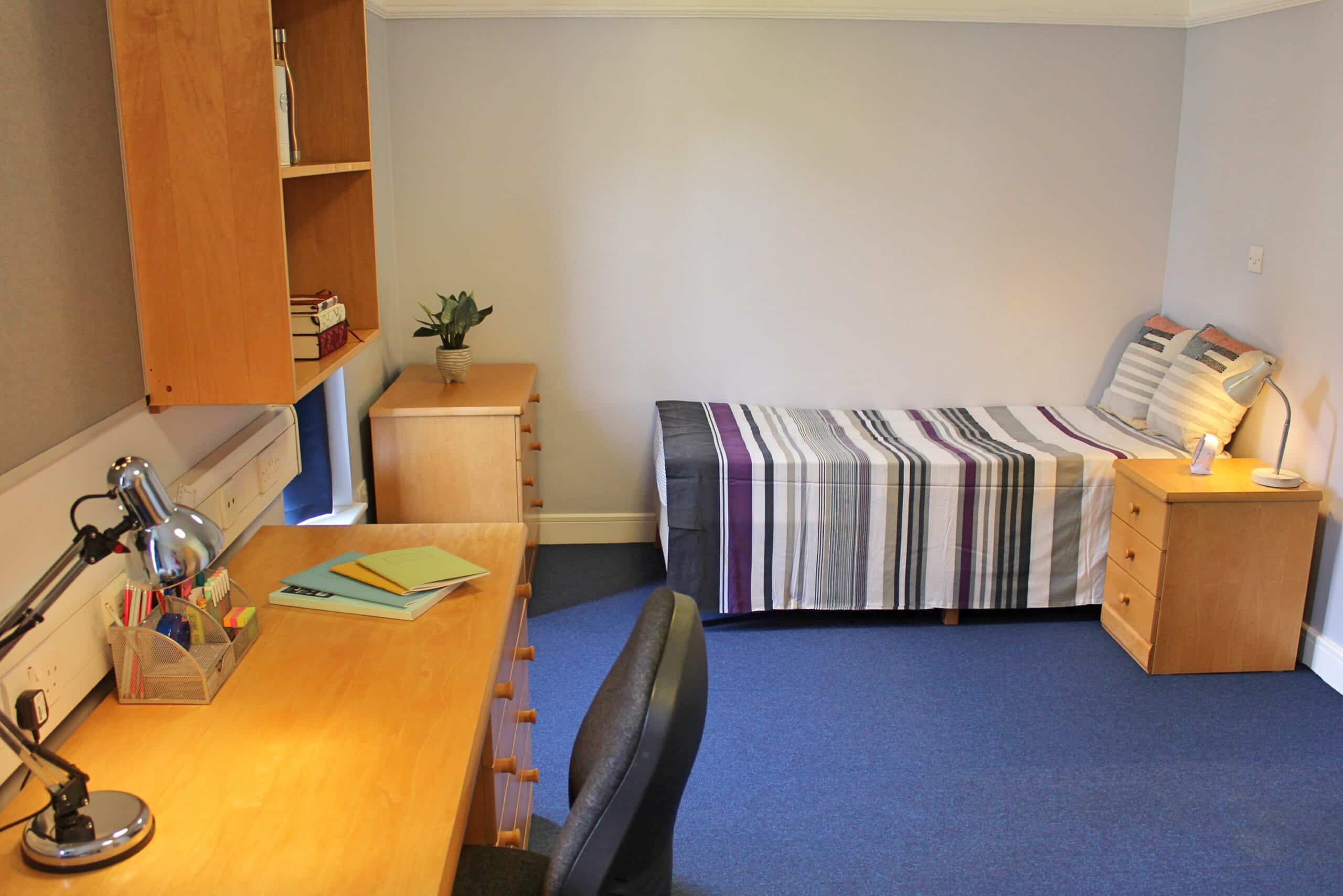 Student bedroom with bed and desk