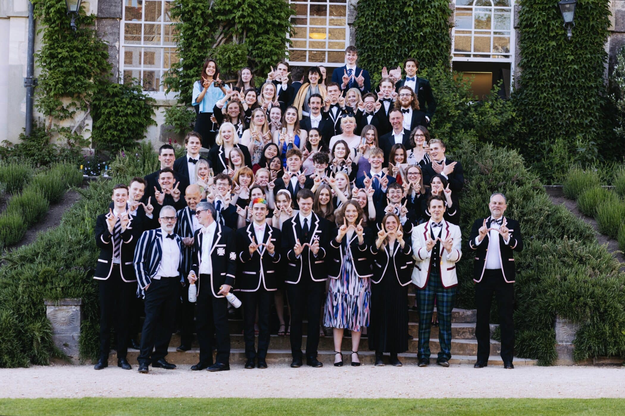 Boat Club in blazers on the quad steps