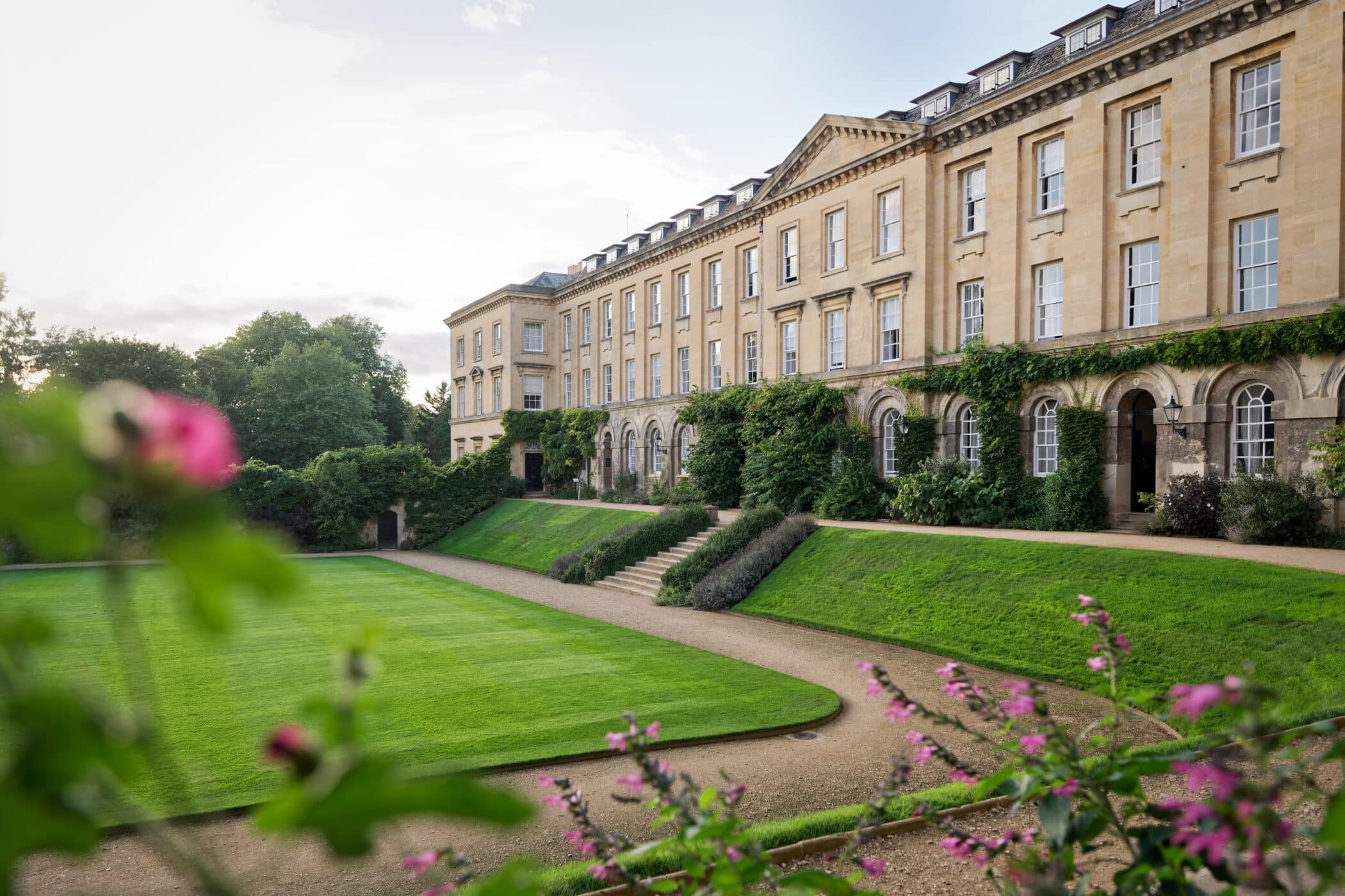 Main Quad stone buildings with foliage in the foreground