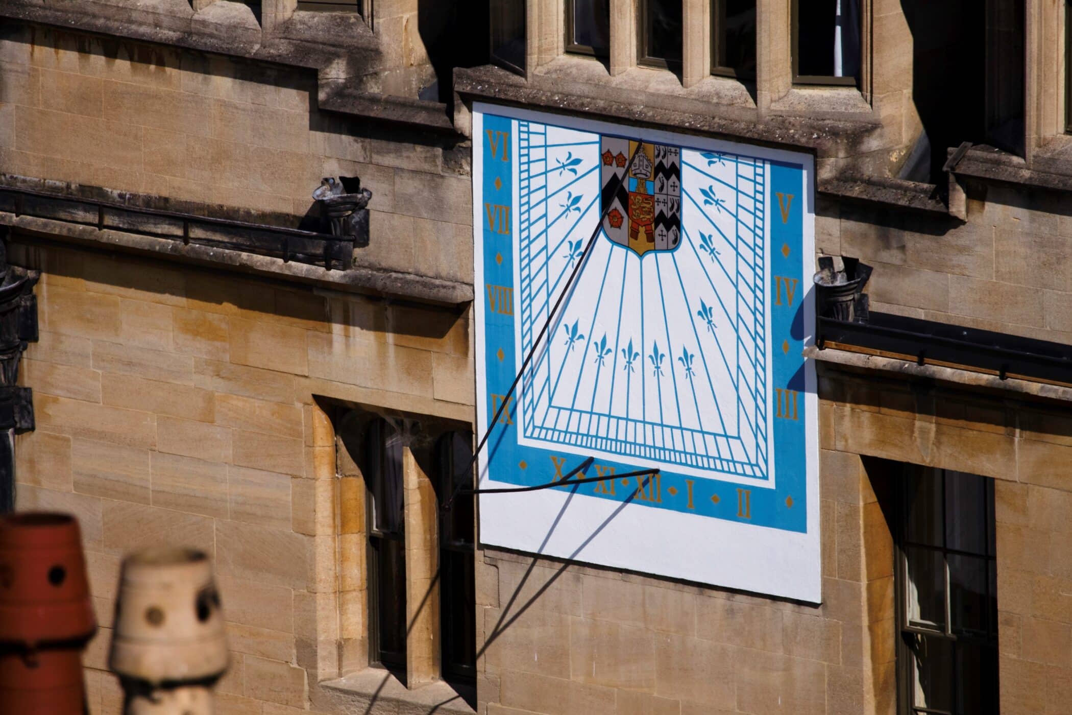 Painted sundial on stone wall at Brasenose College