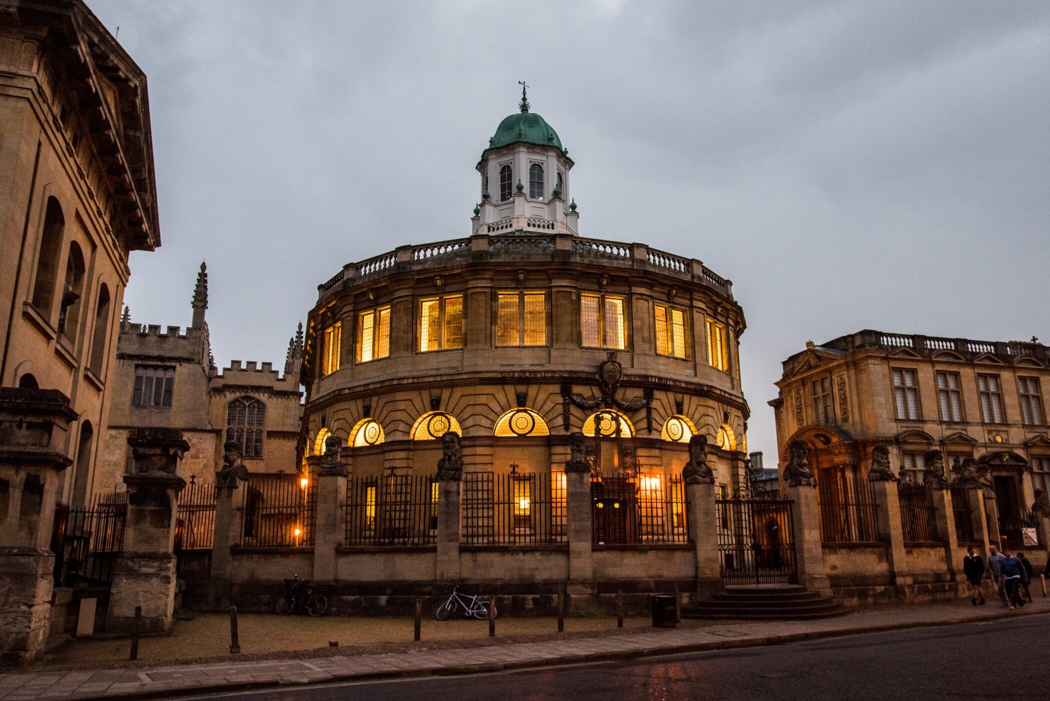 Sheldonian Theatre at dusk with illuminated windows