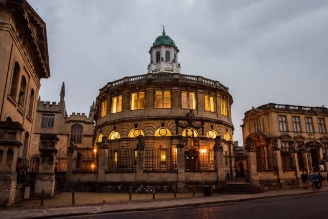 Sheldonian Theatre at dusk with illuminated windows