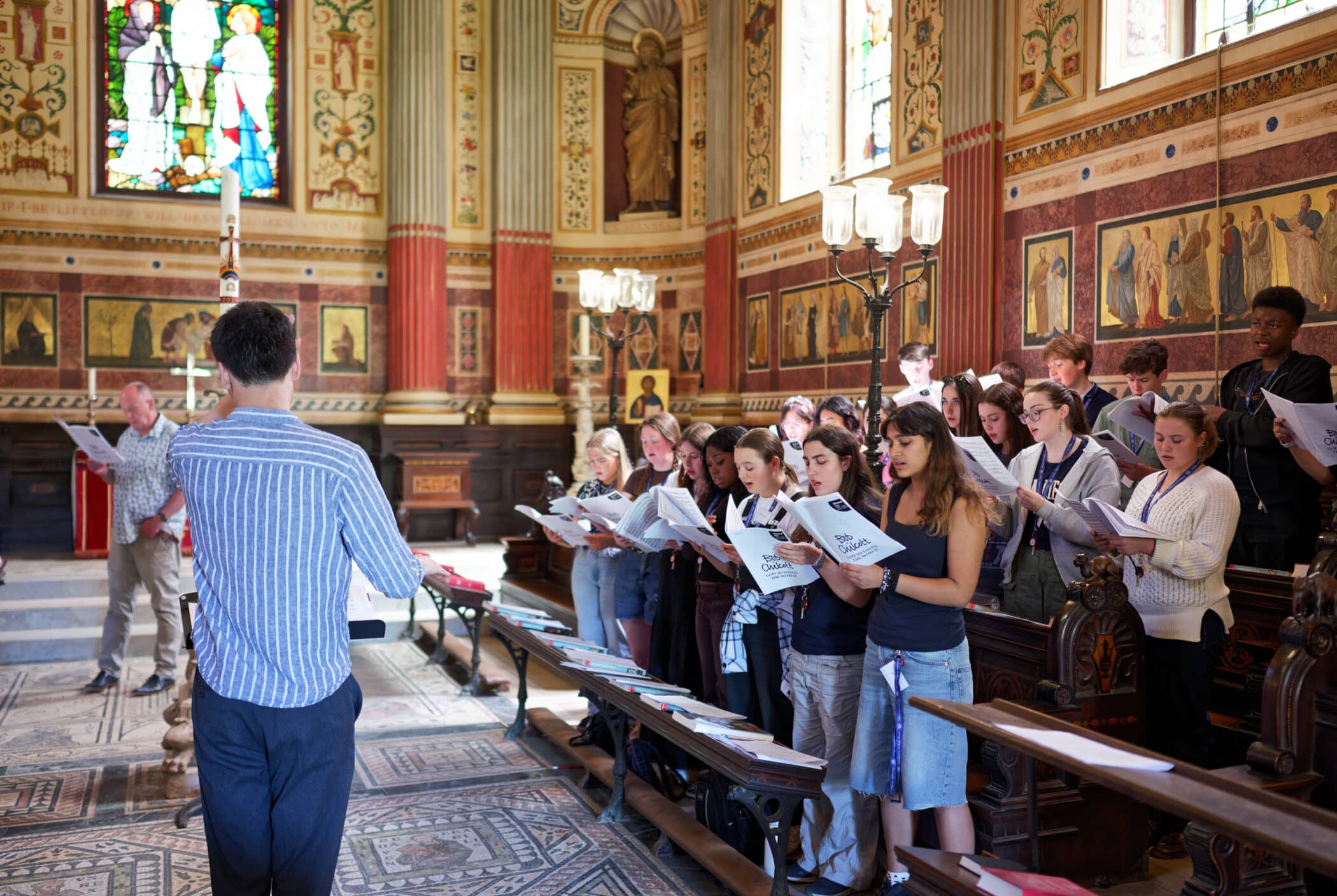 Students singing in the Chapel