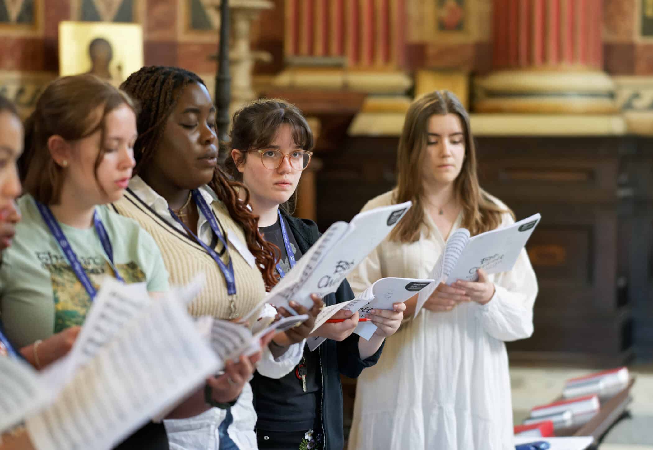 Students singing in the chapel