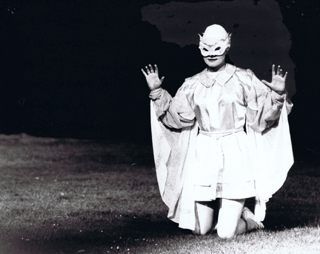 Kneeling actor in costume in The Tempest, 1978