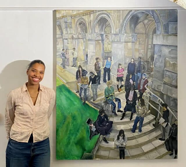 Artist Jada Richard with her painting recreating Edward Halliday's Conversation Piece