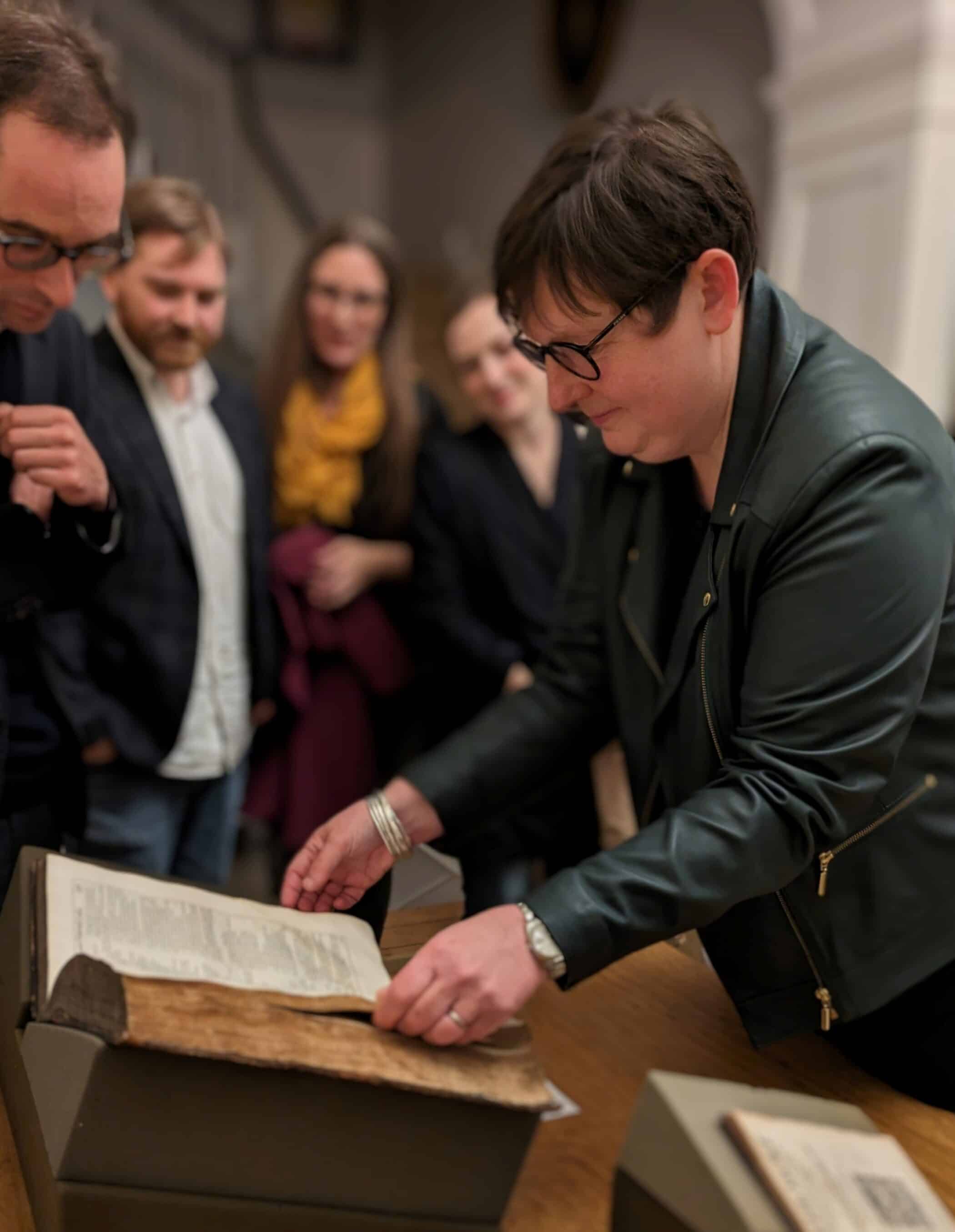 Emma Smith leafing through Shakespeare Folio